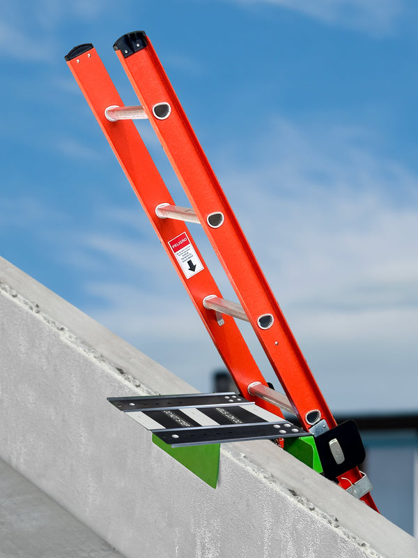 Frontline LAC12 ladder safety dock holding an extension ladder at a parapet wall
