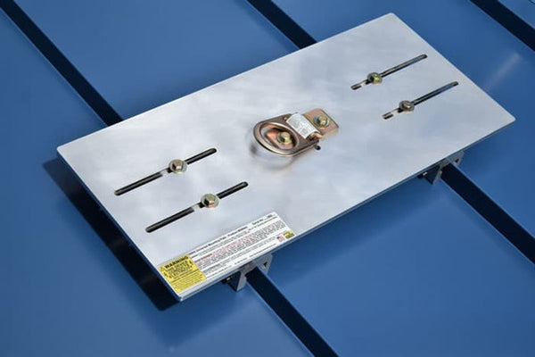 Metal bracket with screws and a label on a blue background