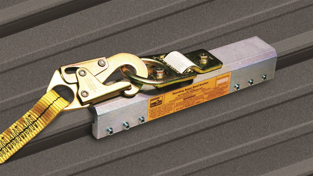 Ratchet strap with a metal clip on a gray surface